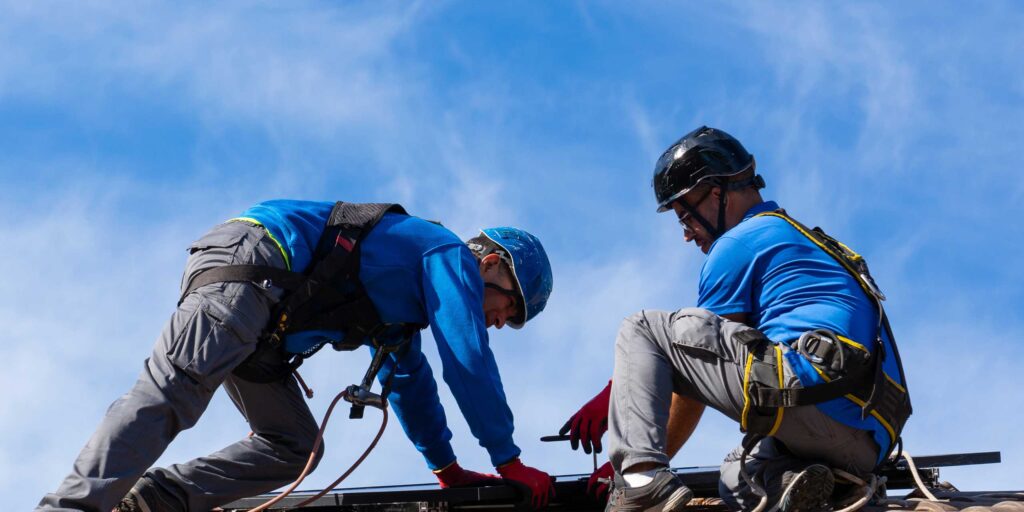 Roofing contractors at work
